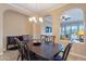 Elegant dining room with a chandelier and views to the living room at 37036 N Stoneware Dr, Queen Creek, AZ 85140