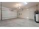 A well-lit garage with an automatic door opener and plenty of space at 37036 N Stoneware Dr, Queen Creek, AZ 85140