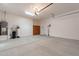 A spacious garage has storage cabinets and space for two vehicles at 37036 N Stoneware Dr, Queen Creek, AZ 85140