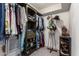 Walk-in closet featuring custom shelving, ample storage, and unique displays for accessories at 4036 E Captain Dreyfus Ave, Phoenix, AZ 85032