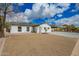 Attractive single-story home featuring desert landscaping and a covered carport at 4036 E Captain Dreyfus Ave, Phoenix, AZ 85032