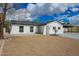 Quaint single-story home with desert landscaping, and a convenient carport at 4036 E Captain Dreyfus Ave, Phoenix, AZ 85032
