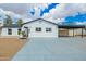 Charming single-story home with modern black and white trim and a covered carport at 4036 E Captain Dreyfus Ave, Phoenix, AZ 85032
