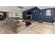 Open living room boasts new flooring, accent wall, fireplace, and comfortable seating at 4036 E Captain Dreyfus Ave, Phoenix, AZ 85032