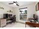 Office with a large window, a ceiling fan, and a desk for comfortable work at 4036 E Captain Dreyfus Ave, Phoenix, AZ 85032