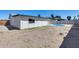A backyard view of gravel with a fenced in yard and blue pool at 4207 W Poinsettia Dr, Phoenix, AZ 85029