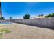Gravel backyard features a fenced pool, lush lawn, and block wall at 4207 W Poinsettia Dr, Phoenix, AZ 85029