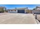 Charming single-story home with a two-car garage, long driveway, and low-maintenance desert landscaping at 4207 W Poinsettia Dr, Phoenix, AZ 85029