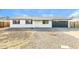Charming single-story home featuring a well-maintained gravel yard, attached garage, and a cozy front porch at 4207 W Poinsettia Dr, Phoenix, AZ 85029