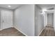 Hallway with a light-colored wall and wood-look vinyl flooring at 4207 W Poinsettia Dr, Phoenix, AZ 85029