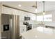 Modern kitchen with stainless steel appliances, white cabinets, subway tile backsplash, and quartz countertops at 4207 W Poinsettia Dr, Phoenix, AZ 85029