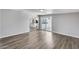 Open floor plan living room features wood-look flooring, and open access to back yard at 4207 W Poinsettia Dr, Phoenix, AZ 85029
