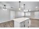 Open concept living room with fan, recessed lighting, and view into kitchen area at 4207 W Poinsettia Dr, Phoenix, AZ 85029