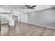 Bright open-concept living area with wood flooring, recessed lighting, and a ceiling fan at 4207 W Poinsettia Dr, Phoenix, AZ 85029