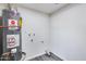 Utility room features a hot water tank and white walls at 4207 W Poinsettia Dr, Phoenix, AZ 85029