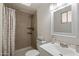 Bathroom features a shower with tile surround and glass shelves, along with a modern sink and vanity at 4257 E Marino Dr, Phoenix, AZ 85032