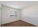 Bedroom showcasing a window for natural light, and a closet at 4257 E Marino Dr, Phoenix, AZ 85032