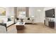 Bright living room with modern furnishings, neutral decor, and stylish tile flooring at 4257 E Marino Dr, Phoenix, AZ 85032