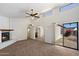 Bright living room with a cozy fireplace, high ceilings, and an open layout perfect for entertaining guests at 4257 E Marino Dr, Phoenix, AZ 85032