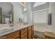 Bright bathroom features double sinks, soaking tub, and clerestory windows for natural light at 4369 E Coal St, San Tan Valley, AZ 85143