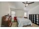 Well-lit bedroom with a ceiling fan and large windows at 4369 E Coal St, San Tan Valley, AZ 85143