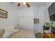 Comfortable bedroom boasts a ceiling fan, closet, and natural light, ideal for relaxation at 4369 E Coal St, San Tan Valley, AZ 85143