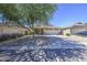Charming home with desert landscaping, a covered porch, and an American flag at 4369 E Coal St, San Tan Valley, AZ 85143