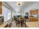 Kitchen and dining area boasting bright natural light, wooden cabinetry and an open layout at 4369 E Coal St, San Tan Valley, AZ 85143