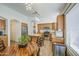 Bright kitchen view showcasing wooden cabinets, stainless steel appliances, island, and a wooden dining set at 4369 E Coal St, San Tan Valley, AZ 85143