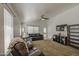 Inviting living room with vaulted ceilings, dark leather sofas, and neutral carpet at 4369 E Coal St, San Tan Valley, AZ 85143