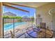 Relaxing covered patio featuring a cozy seating area and views of the private backyard pool at 4369 E Coal St, San Tan Valley, AZ 85143