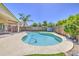 Inviting pool area with a sparkling pool, surrounded by lush landscaping, and outdoor entertaining space at 4369 E Coal St, San Tan Valley, AZ 85143