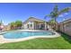 Backyard view of private pool and artificial turf, great for outdoor entertaining in a low maintenance setting at 4369 E Coal St, San Tan Valley, AZ 85143