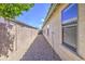 Gravel-covered side yard of the home surrounded by block wall for added privacy at 4369 E Coal St, San Tan Valley, AZ 85143