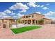 Spacious backyard with manicured lawn, built in grill, and a pool at 4419 W Lodge Dr, Laveen, AZ 85339