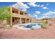 Large backyard with a private pool, rocks, and beautiful landscaping at 4419 W Lodge Dr, Laveen, AZ 85339