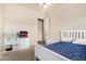 This bright bedroom offers a ceiling fan and ample natural light, creating a cozy and inviting space at 4419 W Lodge Dr, Laveen, AZ 85339