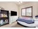 This bedroom features a window with plantation shutters for privacy and light control at 4419 W Lodge Dr, Laveen, AZ 85339