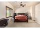 Bedroom featuring neutral walls, a ceiling fan, and ample natural light, creating a serene atmosphere at 4419 W Lodge Dr, Laveen, AZ 85339
