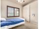 Bright bedroom boasts a ceiling fan and a window with plantation shutters for comfort and privacy at 4419 W Lodge Dr, Laveen, AZ 85339