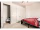 Modest bedroom with carpet, a bed, walk-in closet, and ceiling fan at 4419 W Lodge Dr, Laveen, AZ 85339