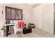 Bedroom featuring plantation shutters and comfortable chair to create a relaxing atmosphere at 4419 W Lodge Dr, Laveen, AZ 85339