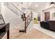 Open foyer with staircase, tile flooring, and view into the main living area at 4419 W Lodge Dr, Laveen, AZ 85339