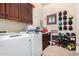 Laundry room with washer, dryer, utility sink, and cabinets at 4419 W Lodge Dr, Laveen, AZ 85339