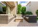 Beautiful outdoor patio with a fire pit, comfortable seating, and lush greenery at 4467 E Remington Dr, Gilbert, AZ 85297