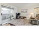 Living room featuring access to private balcony, offering a tranquil outdoor space for leisure and enjoyment at 4554 E Paradise Village N Pkwy # 249, Phoenix, AZ 85032