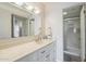 Bright bathroom featuring a vanity with white countertop and a shower with glass door at 4554 E Paradise Village N Pkwy # 249, Phoenix, AZ 85032