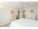 Bedroom featuring light-colored walls and ceiling fan, complemented by gray-toned flooring at 4554 E Paradise Village N Pkwy # 249, Phoenix, AZ 85032