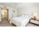 Bright bedroom boasts ceiling fan, bedside table, and stylish gray-toned flooring at 4554 E Paradise Village N Pkwy # 249, Phoenix, AZ 85032