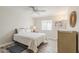 Well-lit bedroom featuring a comfortable bed, stylish flooring, and a ceiling fan at 4554 E Paradise Village N Pkwy # 249, Phoenix, AZ 85032